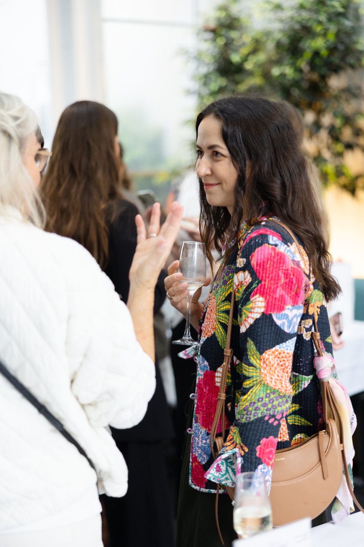A guest deep in conversation during the networking hour