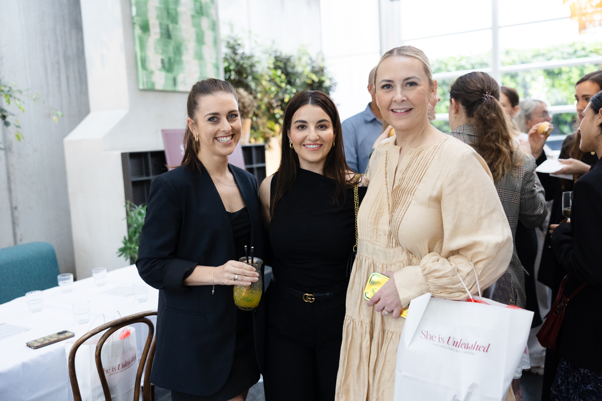 Three guests with She Is Unleashed goodie bags