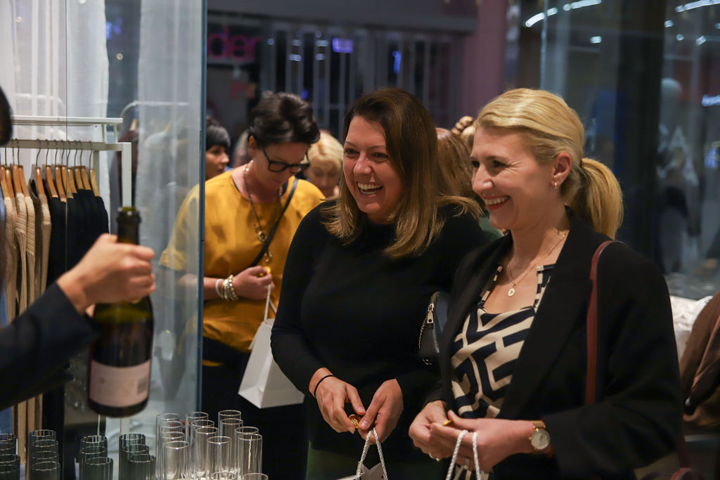 Attendees enjoying the evening in store