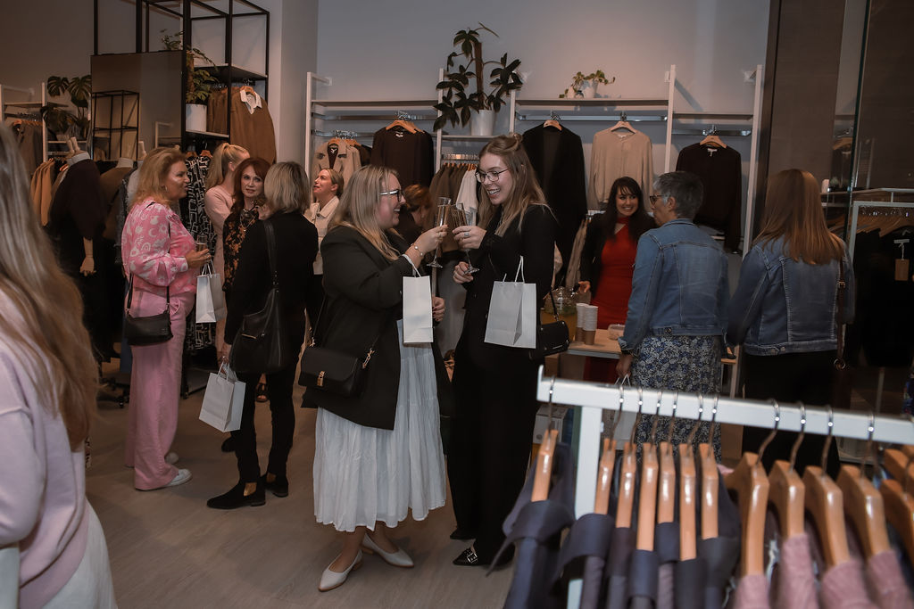 The room full of guests browsing the racks