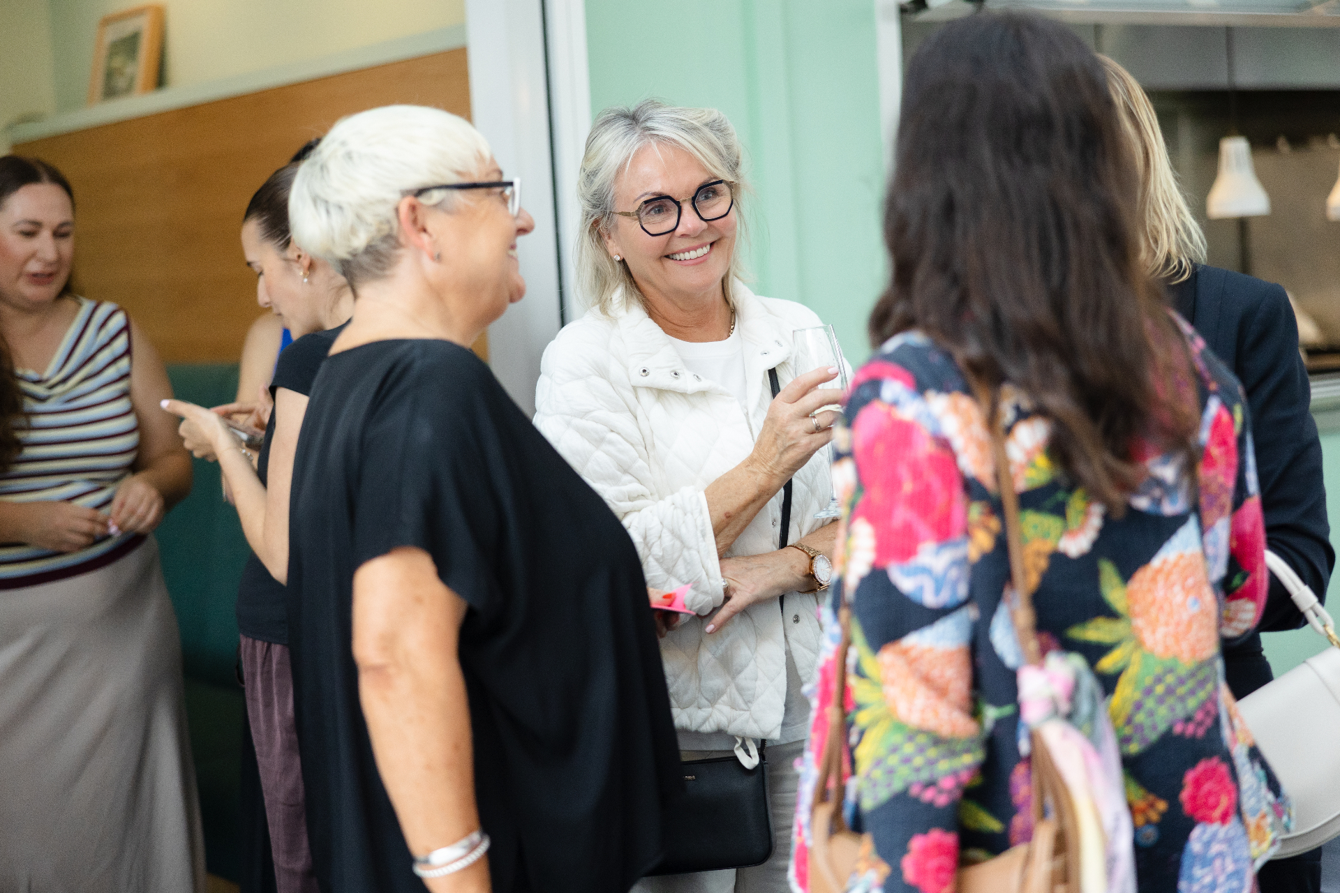 Guests laughing together during the welcome drinks
