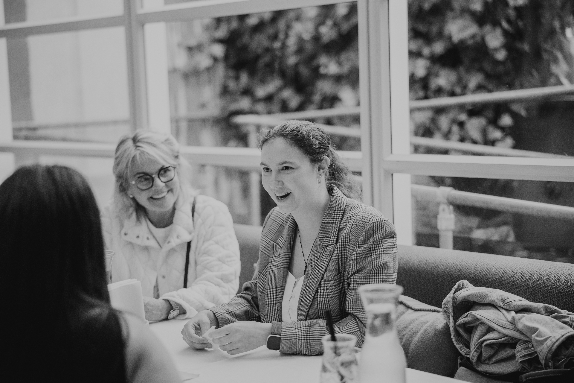 Two women deep in conversation during a Better Together table discussion