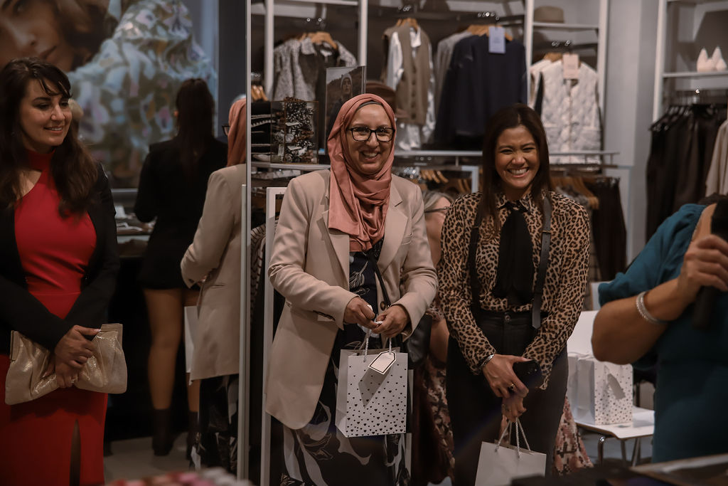 Guests smiling as prizes are announced